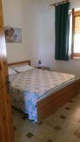 A bed or beds in a room at Villa Magnolia Appartamenti