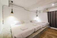 Postel nebo postele na pokoji v ubytování Your Space Hotel Prasingh