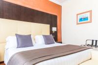 A bed or beds in a room at Vibe Nazionale