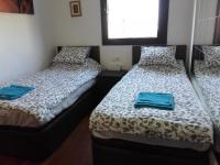 Postel nebo postele na pokoji v ubytování Jie Apartment