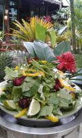 a plate of salad with greens and vegetables on a table at RELAX ECO Life Center-Khao Lak in Khao Lak