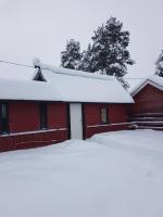 Camp Caroli Wooden Cabins v zimě
