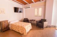 Postel nebo postele na pokoji v ubytování Hotel Rural El Cortijo
