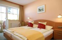 Łóżko lub łóżka w pokoju w obiekcie Gasthaus-Landhotel Traunstein