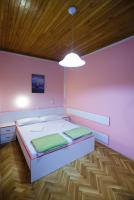 Postel nebo postele na pokoji v ubytování Apartments Slavko