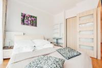 Posteľ alebo postele v izbe v ubytovaní Apartamenty Sun & Snow Horyzont