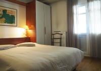 A bed or beds in a room at Best Point To Stay