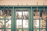 a group of chandeliers hanging in front of windows at Sunday Home in Dayin