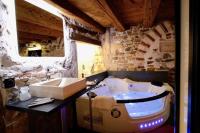 a bathroom with a sink and a bath tub at Le Clos de Sainte Croix in Lyon