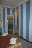 A bed or beds in a room at Hotel Villa Pina