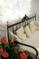 A bed or beds in a room at Hotel Villa Pina