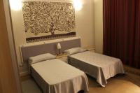 Łóżko lub łóżka w pokoju w obiekcie Ursino rooms apartment