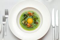 een bord voedsel met een ei en groenten bij The Hermitage Hotel - OCEANA COLLECTION in Bournemouth