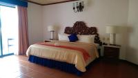 a bedroom with a large bed in a room at Ecotel Quinta Regia in Valladolid