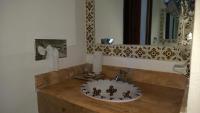 a bathroom with a sink and a mirror at Ecotel Quinta Regia in Valladolid