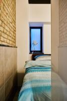 Een bed of bedden in een kamer bij Apartment and Rooms Marinac