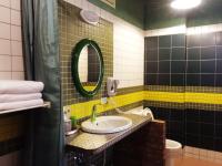 a bathroom with a sink and a mirror at MiCarro B&amp;B in Dongshan