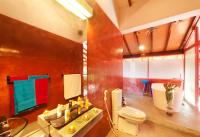 a bathroom with a toilet and a sink and a tub at Dickman Resort "The Boutique Hotel" in Negombo