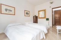 A bed or beds in a room at Cristina Rossi Bed&Breakfast