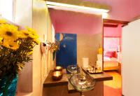 a room with a glass table and a mirror at Dickman Resort "The Boutique Hotel" in Negombo
