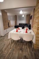 Posedenie v ubytovaní Panoráma City Apartman
