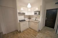 Kuchyňa alebo kuchynka v ubytovaní Panoráma City Apartman