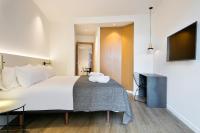 Postel nebo postele na pokoji v ubytování Vale Suites