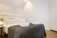 Postel nebo postele na pokoji v ubytování Vale Suites