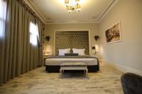 A bed or beds in a room at L'Agora Old Town Hotel & Bazaar
