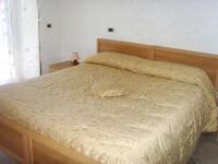 A bed or beds in a room at Casa Lieta