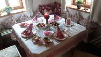 a table with a candle and plates of food on it at Ferienappartement am Leisnitzbach in Tamsweg