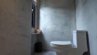 a bathroom with a white toilet in a room at 日月潭山慕藝旅 Sun Moon Inn in Yuchi