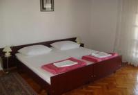 Postel nebo postele na pokoji v ubytování Apartments Radulović