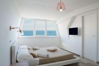 Posteľ alebo postele v izbe v ubytovaní Ostia Holiday Mykonos