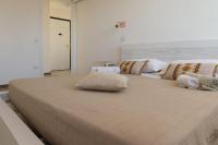 Posteľ alebo postele v izbe v ubytovaní Ostia Holiday Mykonos