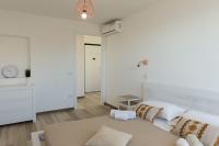 Posteľ alebo postele v izbe v ubytovaní Ostia Holiday Mykonos