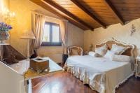 Posteľ alebo postele v izbe v ubytovaní Hotel Villa Calandrino