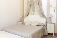 Posteľ alebo postele v izbe v ubytovaní Hotel Villa Calandrino