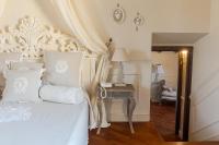 Posteľ alebo postele v izbe v ubytovaní Hotel Villa Calandrino