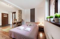 Posteľ alebo postele v izbe v ubytovaní Apartamenty Sun & Snow Kościelisko Residence