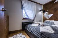 Posteľ alebo postele v izbe v ubytovaní Apartament Szymaszkowa Relax Ski Odkryj Zakopane