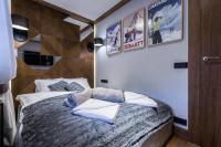 Posteľ alebo postele v izbe v ubytovaní Apartament Szymaszkowa Relax Ski Odkryj Zakopane