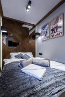 Posteľ alebo postele v izbe v ubytovaní Apartament Szymaszkowa Relax Ski Odkryj Zakopane