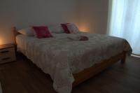Postel nebo postele na pokoji v ubytování Apartments Rogulj