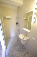 a bathroom with a sink and a mirror at Green 58 B&amp;B in Hengchun South Gate