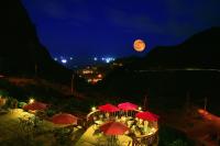 a view of a restaurant with red umbrellas at night at Formosa Arcadian Villa in Jiufen