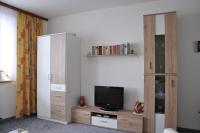 Televízia a/alebo spoločenská miestnosť v ubytovaní Landhaus Neuwirth
