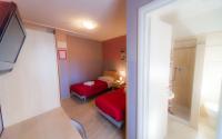 Posteľ alebo postele v izbe v ubytovaní Hotel Albi