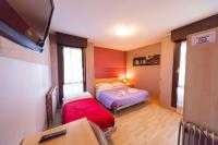 Posteľ alebo postele v izbe v ubytovaní Hotel Albi