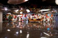 a room with a couch and a reflection in the floor at In One City Inn in Taichung